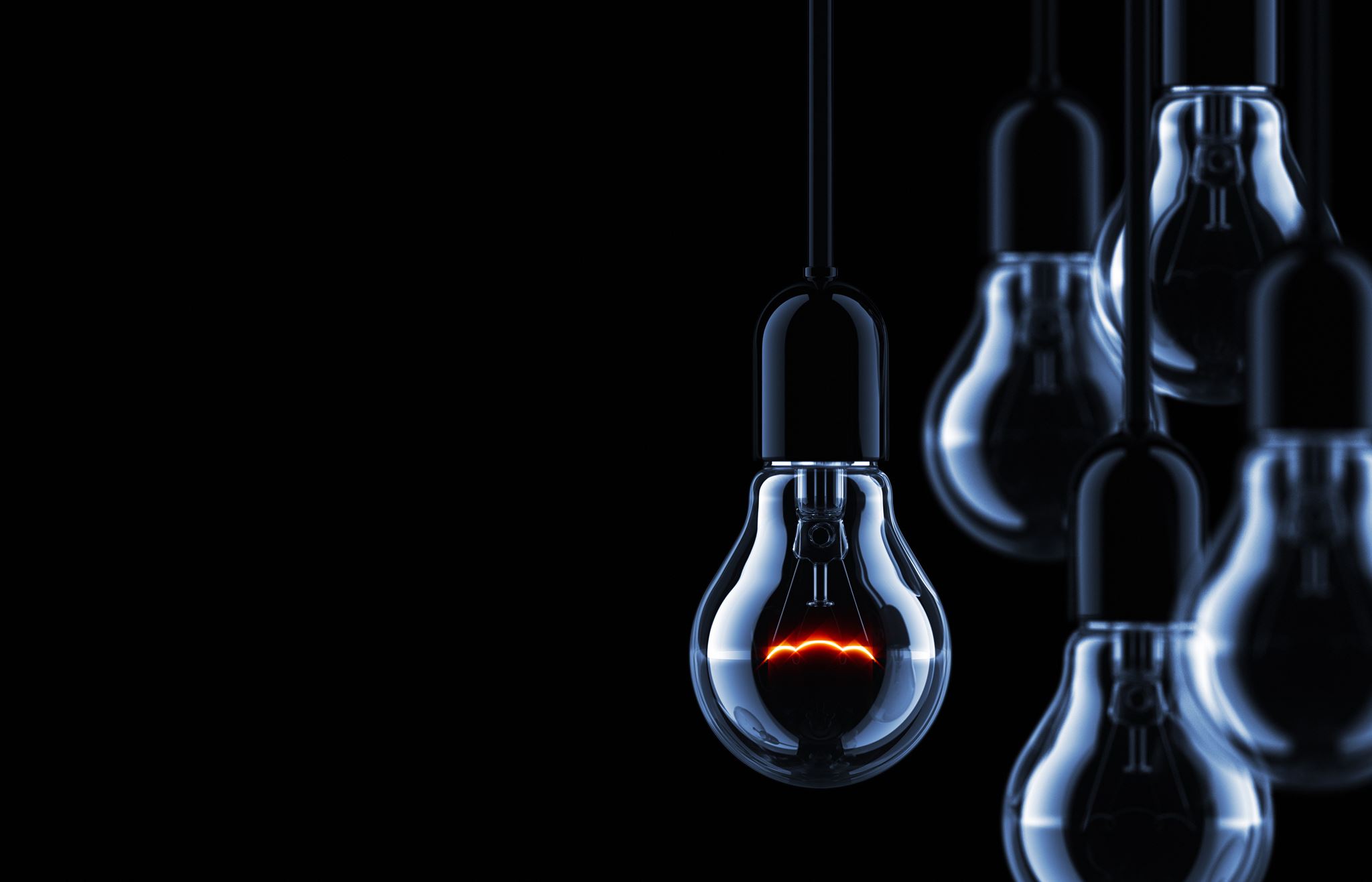 Five-hanging-light-bulbs-in-the-dark-with-one-light-bulb-with-electric-line