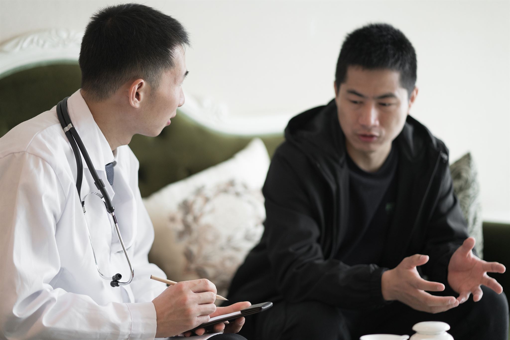 Man-talking-with-a-doctor